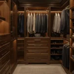 Custom luxury closet with wood cabinetry and integrated lighting