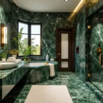 Custom spa bathroom with green marble surfaces, floating vanity, glass shower, and designer lighting
