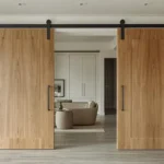Modern barn door with premium hardware in a luxury interior