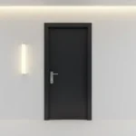 Modern black interior door with contemporary hardware in a minimalist hallway