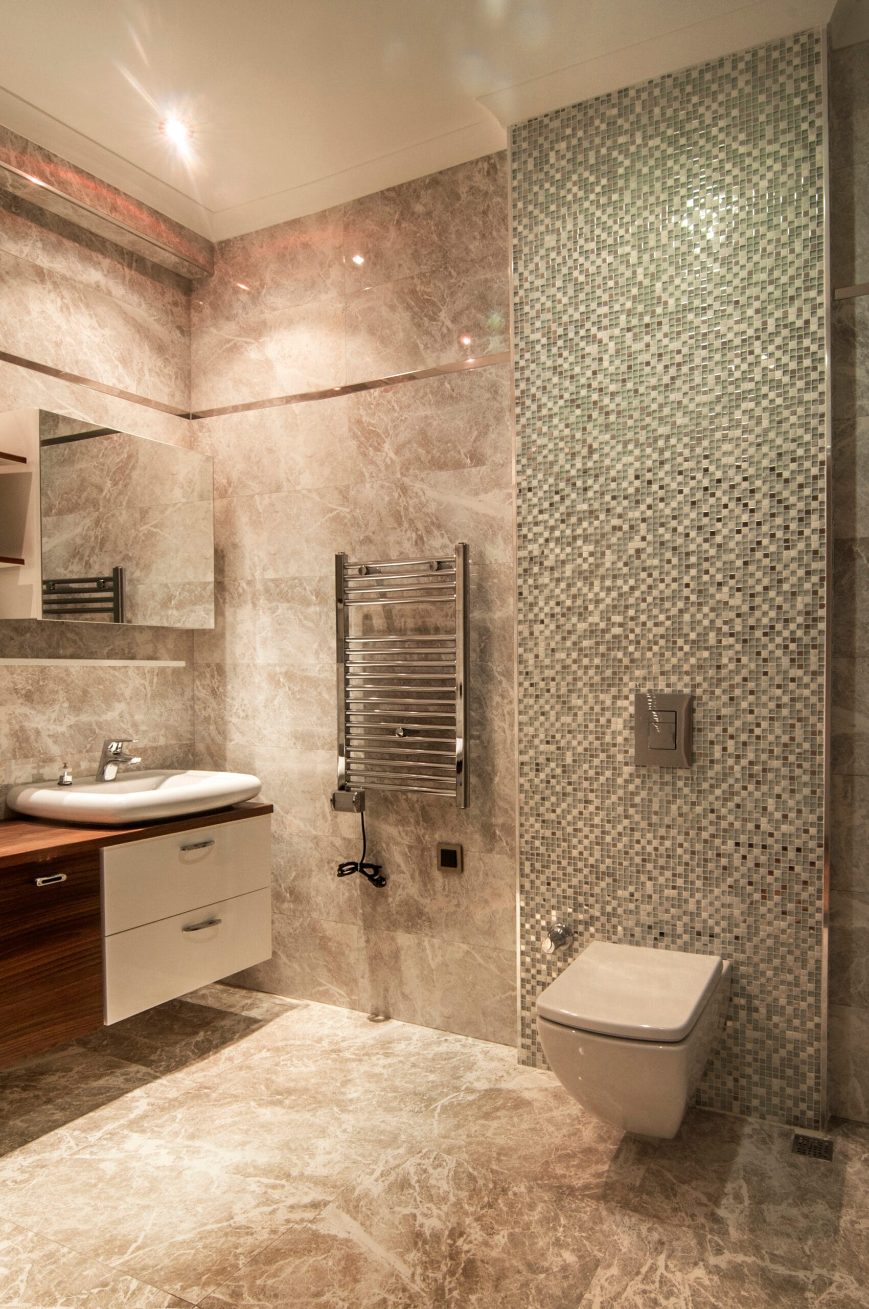 modern luxury tiled bathroom with wall mounted toilet