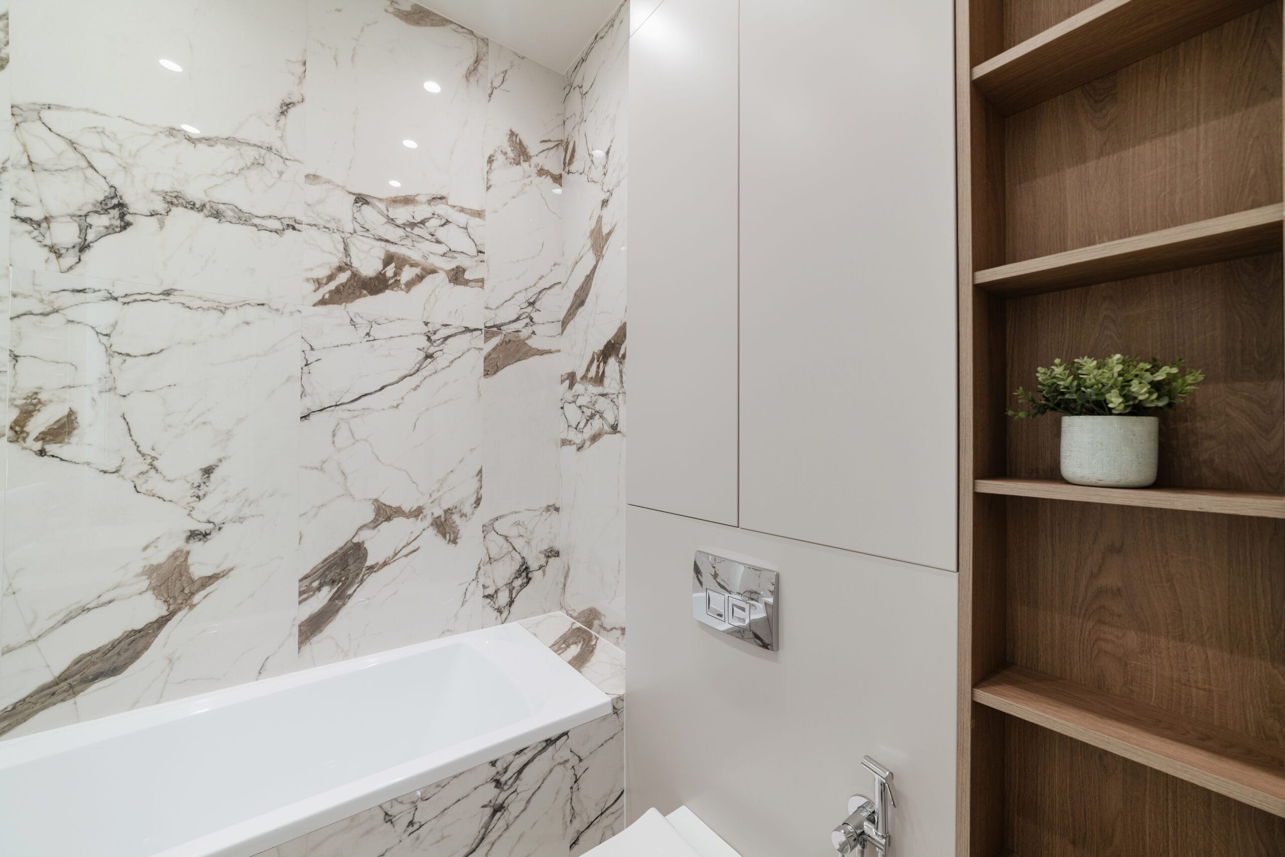 new bathroom interior with white bathtub and wood